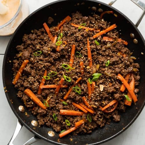 Korean beef and carrots in a pan with kimchi aioli in a blender
