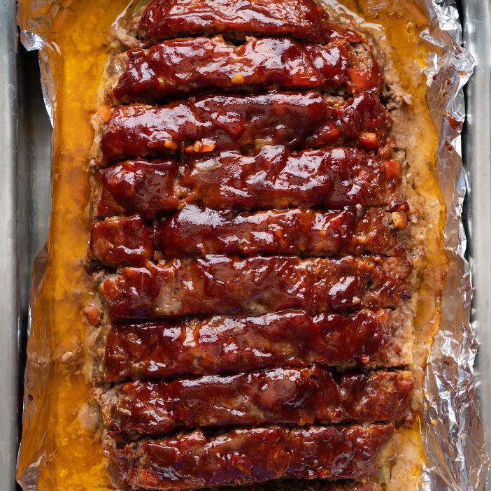 beef and pork meatloaf topped with a Chipotle Ketchup glaze in a tray